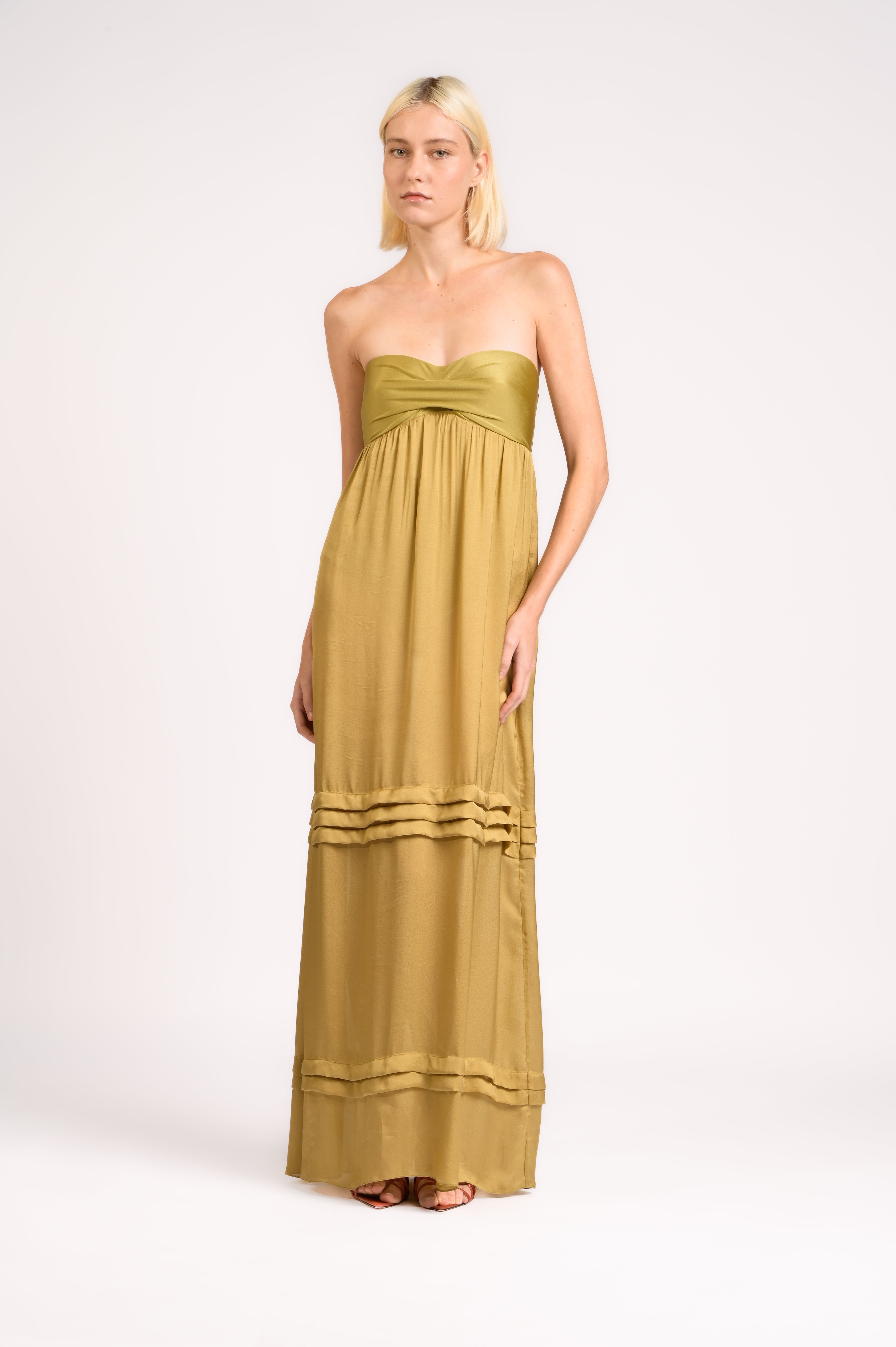 Model wearing the Strapless Beach Dress front, color unique, made from 100% viscose, styled for dinner look 