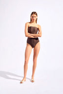 Model wearing the Timeless Strapless Swimsuit Detail Coffee styled for a beach look