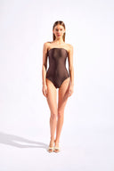Model wearing the Timeless Strapless Swimsuit Front Coffee styled for a beach look