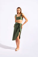 Model wearing the Timeless Straps Bikini Top color croco made from 85% polyamide 15% elastane, styled for a beachwear look