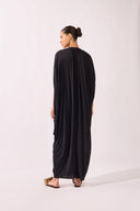 Model wearing the V-Neck Jersey Maxi Dress back color black, made from 100% polyamide, styled for a resort look
