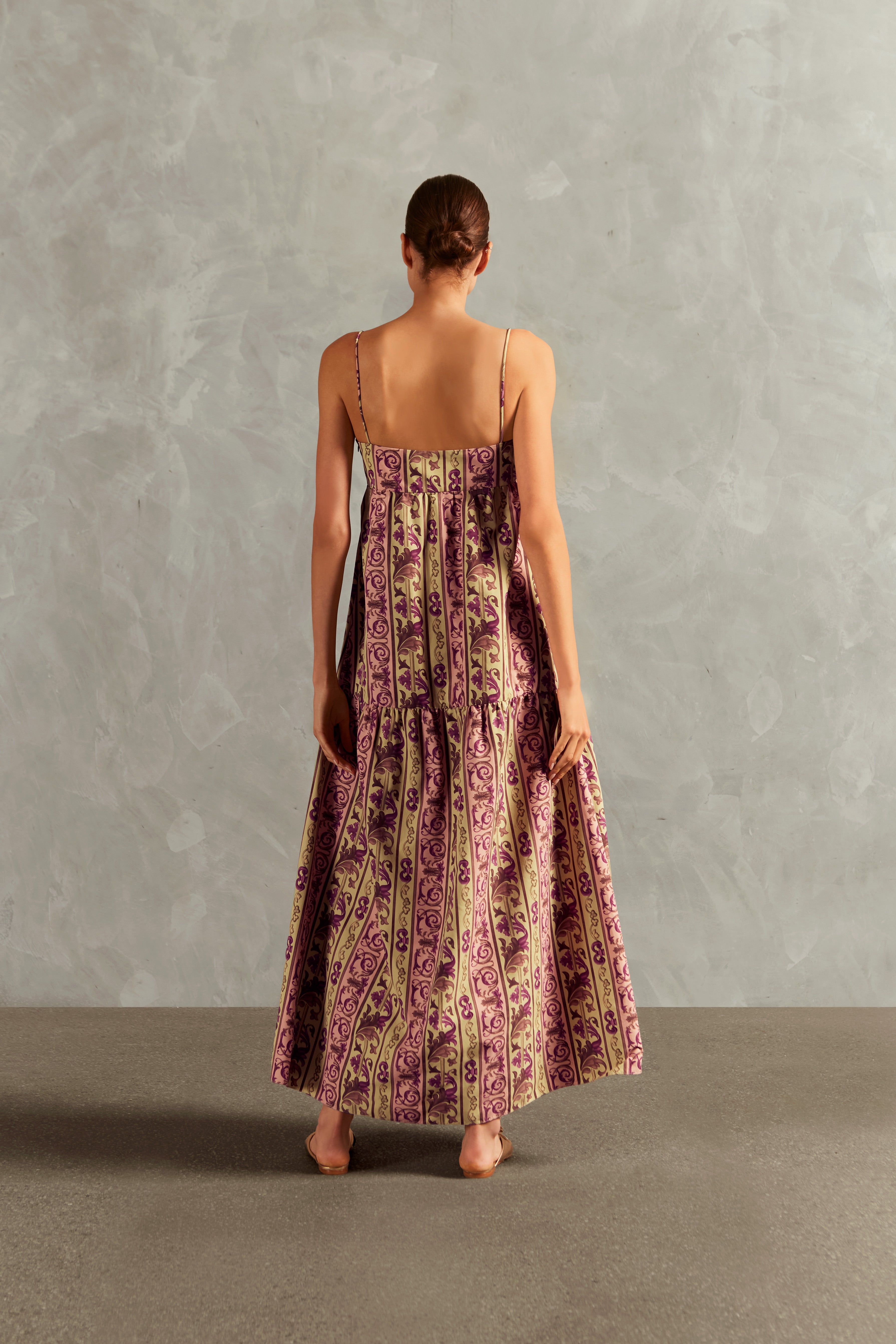 Model wearing the Vintage Citronelle Straps Long Dress Back showcasing its Unique print on 100% Polyamide fabric, styled for a casual look.