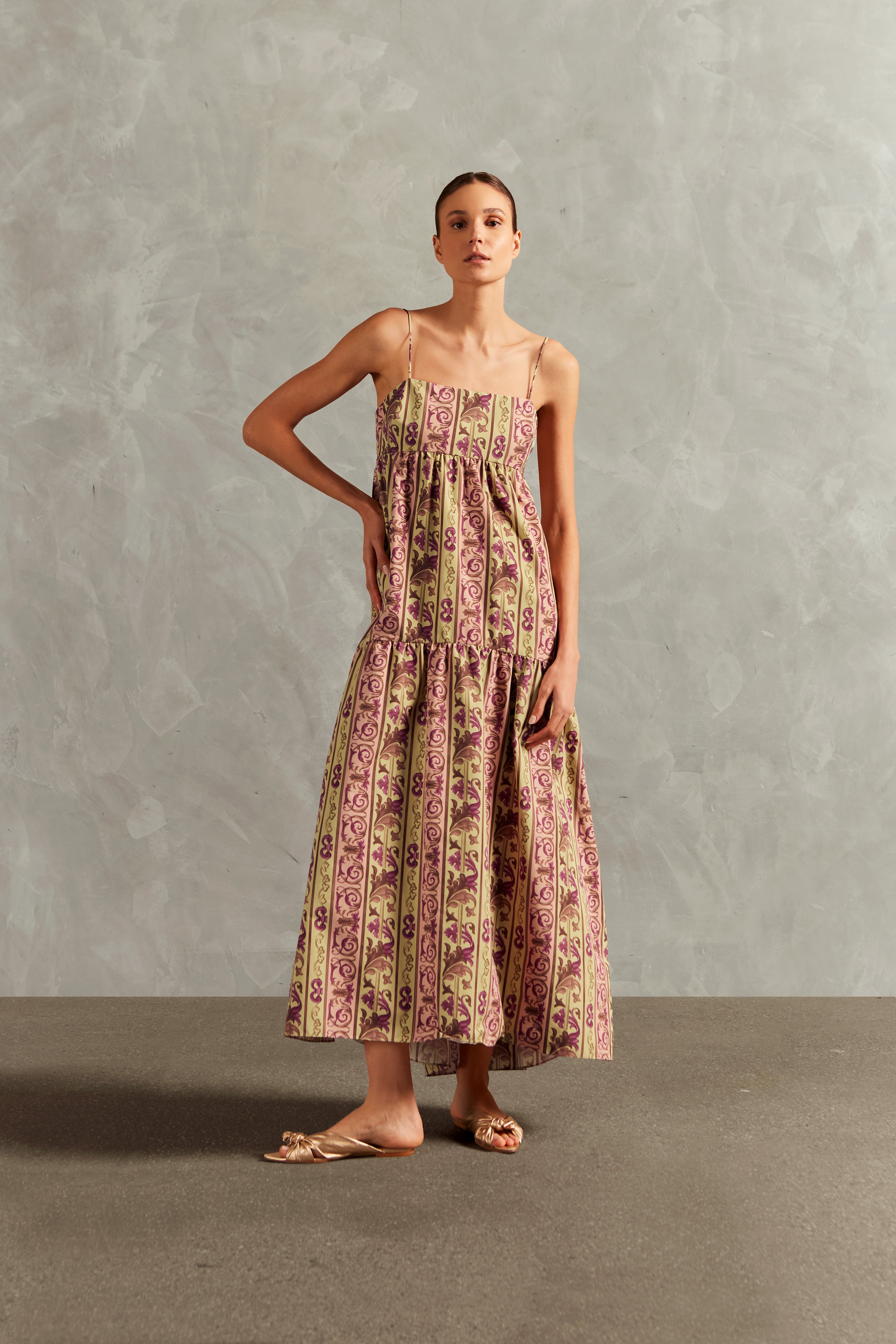 Model wearing the Vintage Citronelle Straps Long Dress Front showcasing its Unique print on 100% Polyamide fabric, styled for a casual look.