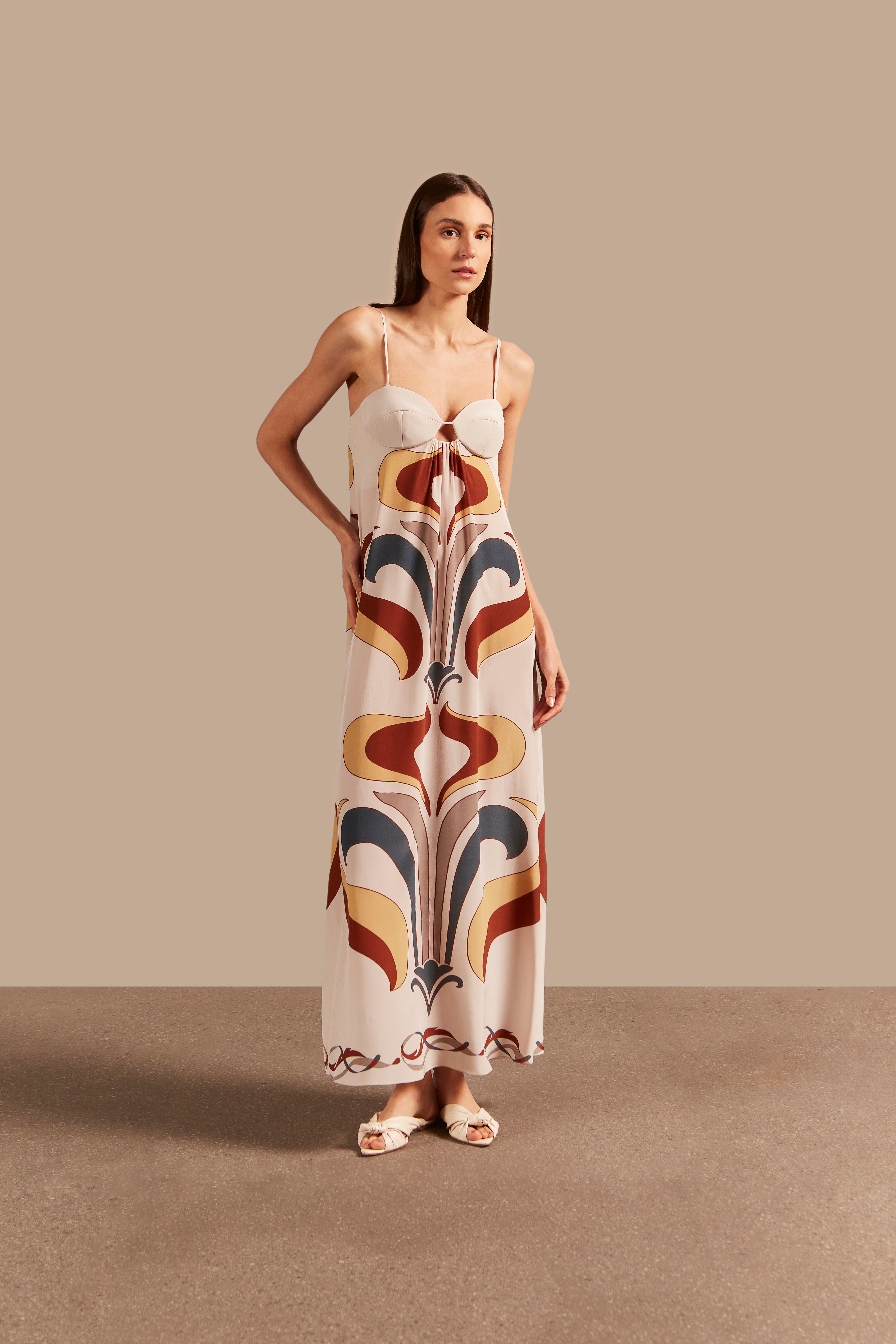 Model wearing the Vintage Lily Off-White Long Dress With Straps showcasing the front of it's vintage-inspired print, on a silk fabric.