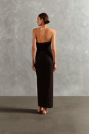 Model wearing the Waves Strapless Long Dress Back showcasing its Black color on 85% Polyamide 15% Elastane fabric, styled for a evening look.  