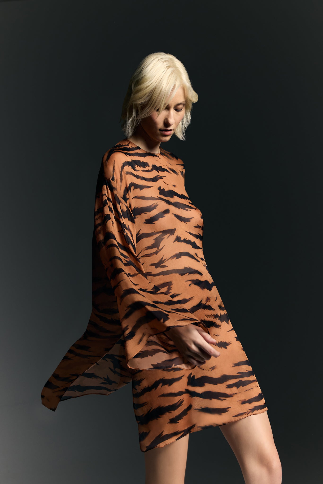 Model wearing the Wide Sleeve Silk Mini Dress detail from the Adriana Degreas and Sabine Getty collab with 100% Silk styled for a casual look.