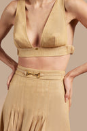 Detail view of Adriana Degreas' Jeans V-Neck Top in denim-inspired caramel, featuring a deep V-neckline and wide straps.