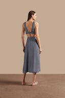 Back view of Adriana Degreas' Jeans V-Neck Top in blue, showcasing its wide straps and natural fabric.