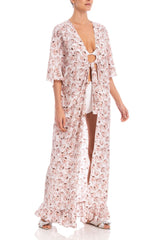 Long kaftan with deep V-neck and ruffle details is cut in a loose silhouette and falls to floor-sweeping hem