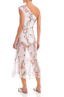 Model wearing the Aglio Midi Skirt With Pleats showcasing the back of it's high-leg piece, with Aglio Print, on a silk fabric.