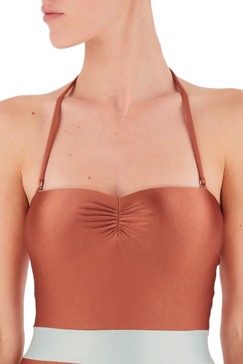 Inspired by glamourous dresses from 1950s, this strapless swimsuit comes with an additional halterneck strap for your comfort fit. Style it with a silk robe on your next vacation