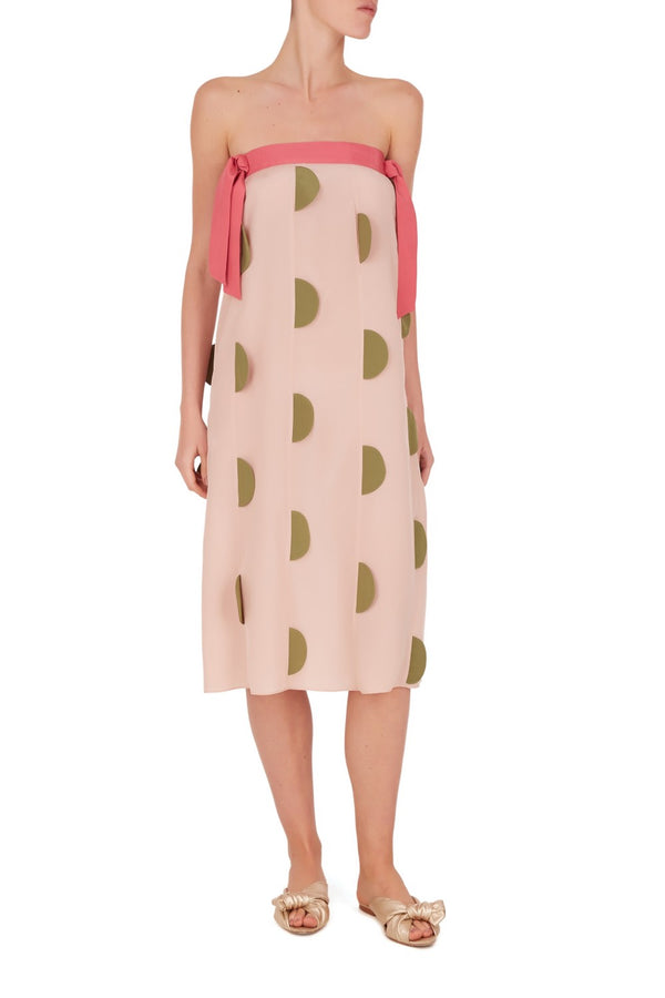 Sometimes all we need in our vacation wardrobe is a statement piece like this polka dot strapless dress