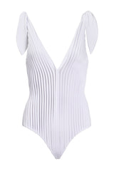 This swimsuit with deep V-neckline and plissé details is made in Brazil and is truly an object d´art