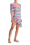 Crafted in silk, this cocktail dress has puffed sleeves and falls perfectly to an asymmetric hem
