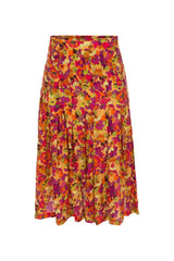 The silk pleated retro skirt matches a silk front knot shirt in the same print for hot summer nights