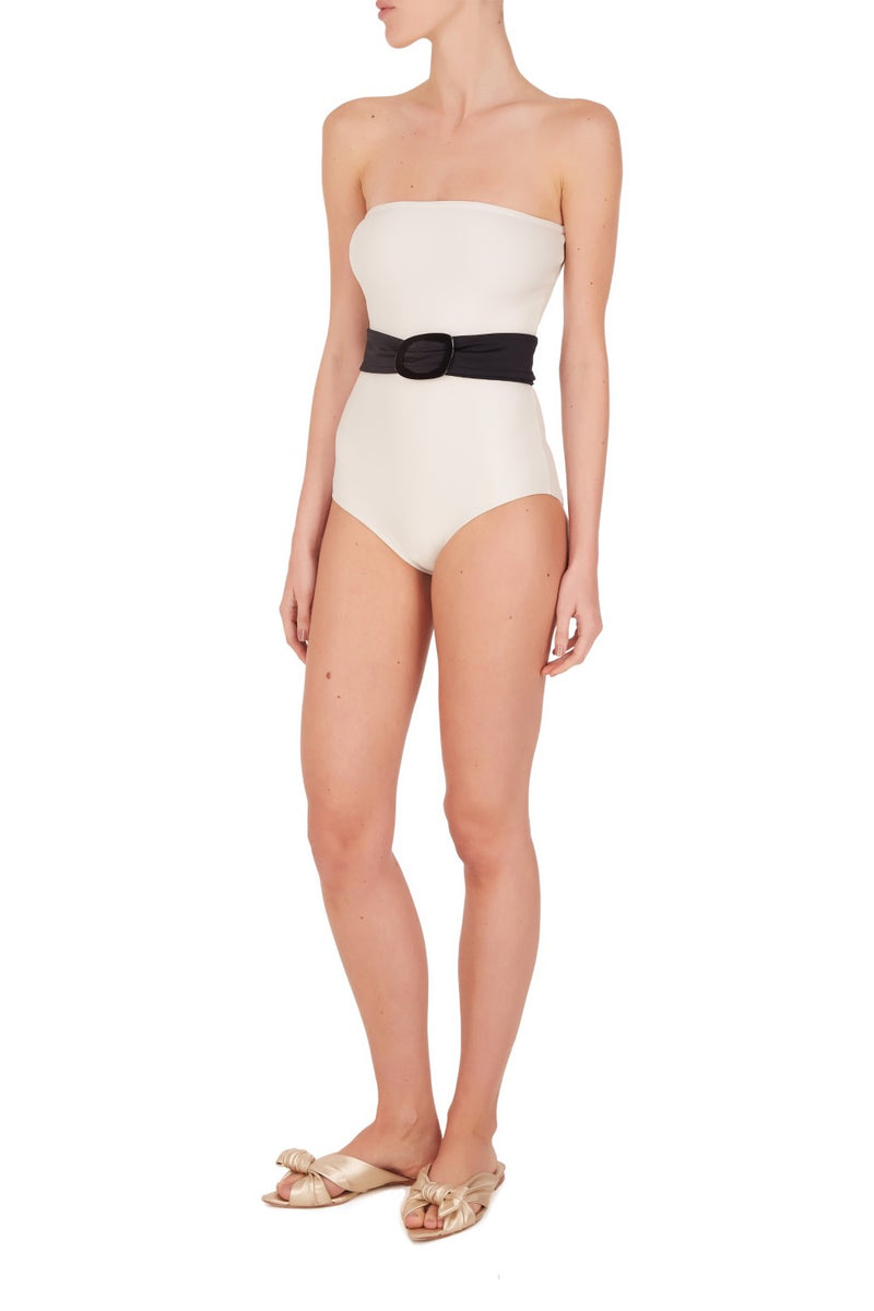 Add a dash of vintage glamour to your vacation wardrobe with this sophisticated black and white swimsuit