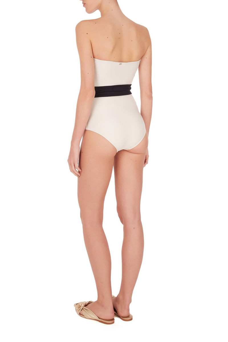 Add a dash of vintage glamour to your vacation wardrobe with this sophisticated black and white swimsuit