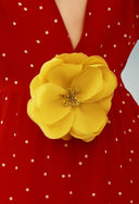 Part of the lable´s DNA, this flower brooch is made of silk fabric and can be worn with one of our elegant swimsuits for a glamorous look poolside