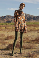 This silk horse pois playsuit is influenced by retro silhouettes
