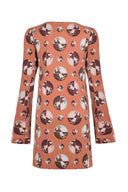 This ‘60s style asymmetric dress matches a legging boot for an evening cocktail party