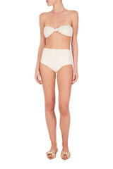 These minimalist aesthetic ivory hot pants are shaped with stretch fabric and embellished with an elegant buckle detail