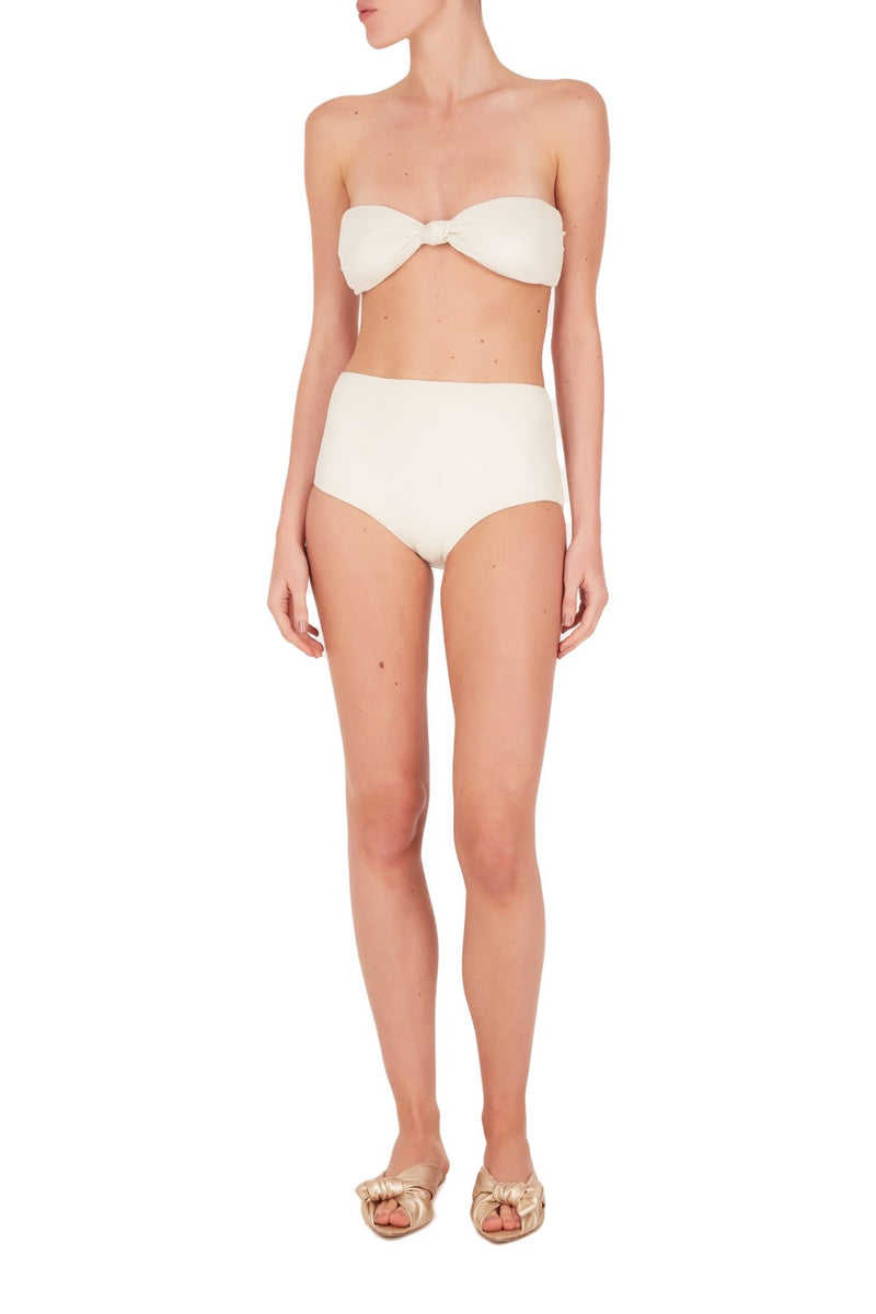 These minimalist aesthetic ivory hot pants are shaped with stretch fabric and embellished with an elegant buckle detail