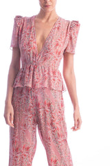 This long jumpsuit with deep V-neck is and elegant option for summer evenings- it´s made of silk and with wide-legs that create the illusion of a longer silhouette. Wear it with sandals for an elegant occasion