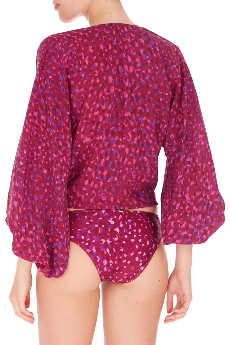 This colored and sophisticated with puffed sleeves shirt is cut from lightweight silk and is detailed with a gathered knot at the deep neckline