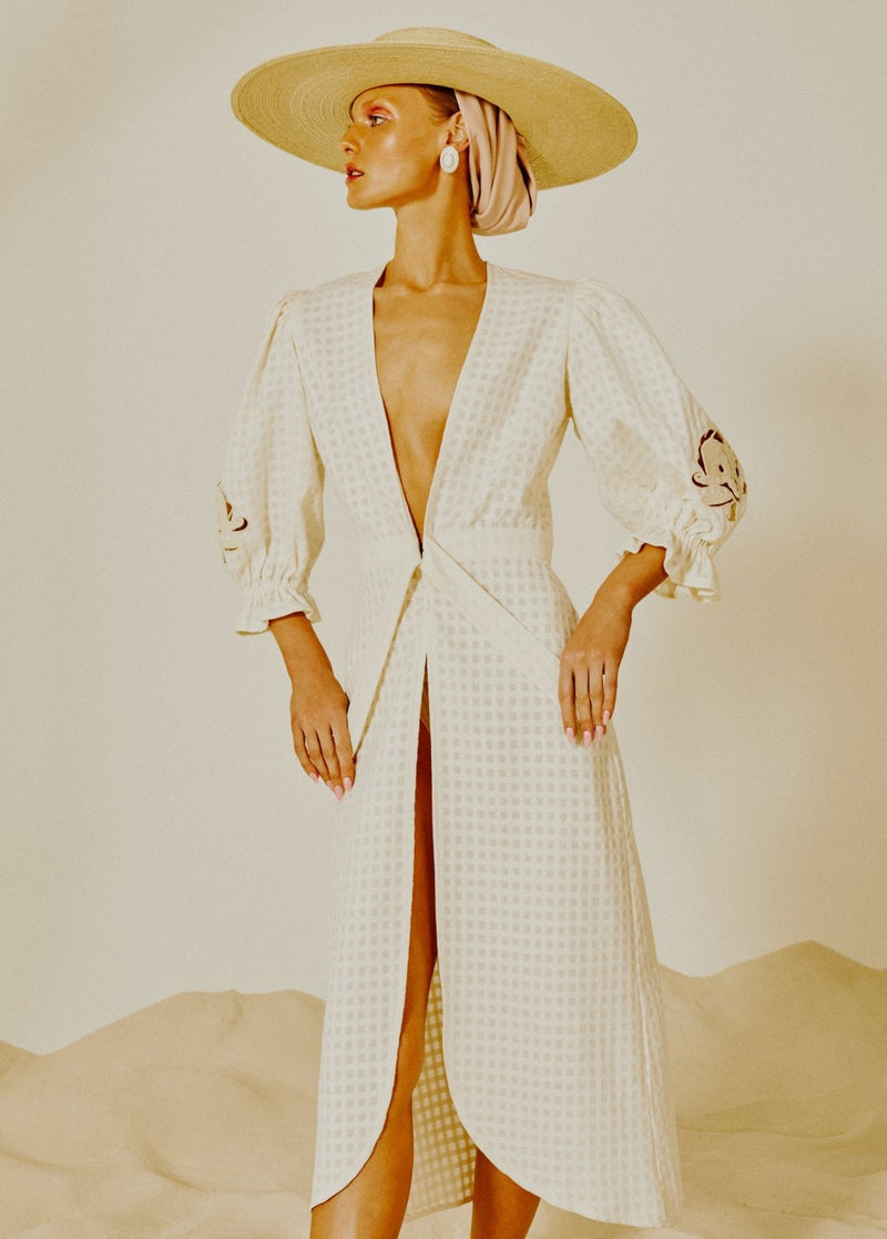 This robe was made to be worn on an exotic getaway, but will look equally elegant in the city