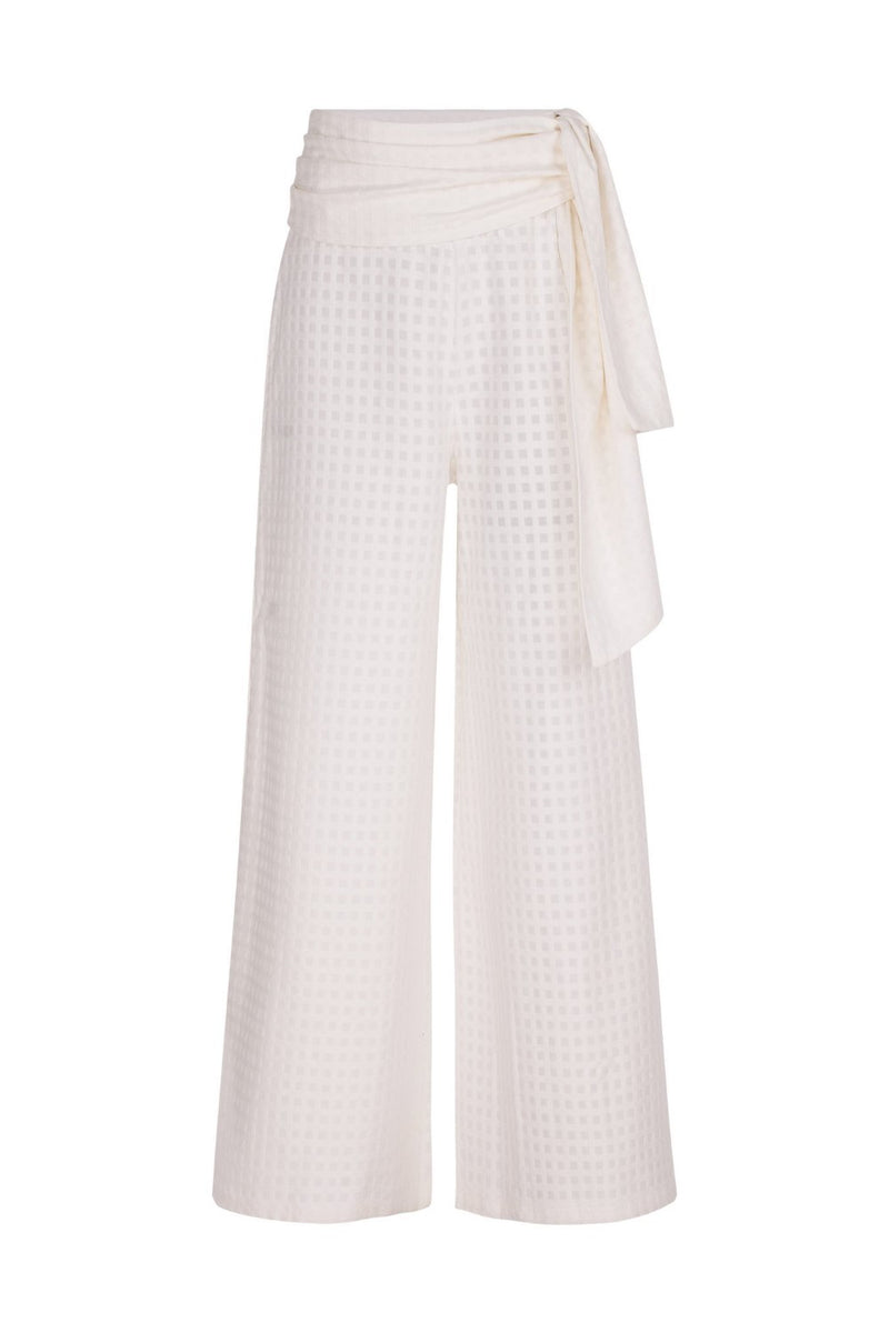 These cotton pants have an extra-long wide leg and can be worn on vacation with a matching shirt and slides for a contemporary outfit