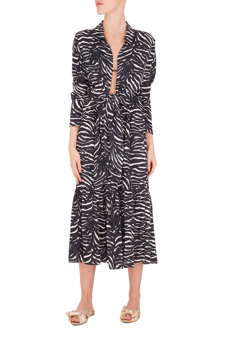 This wraparound viscose zebra skirt is shaped with high-rise waist and is an elegant piece for summer weekends